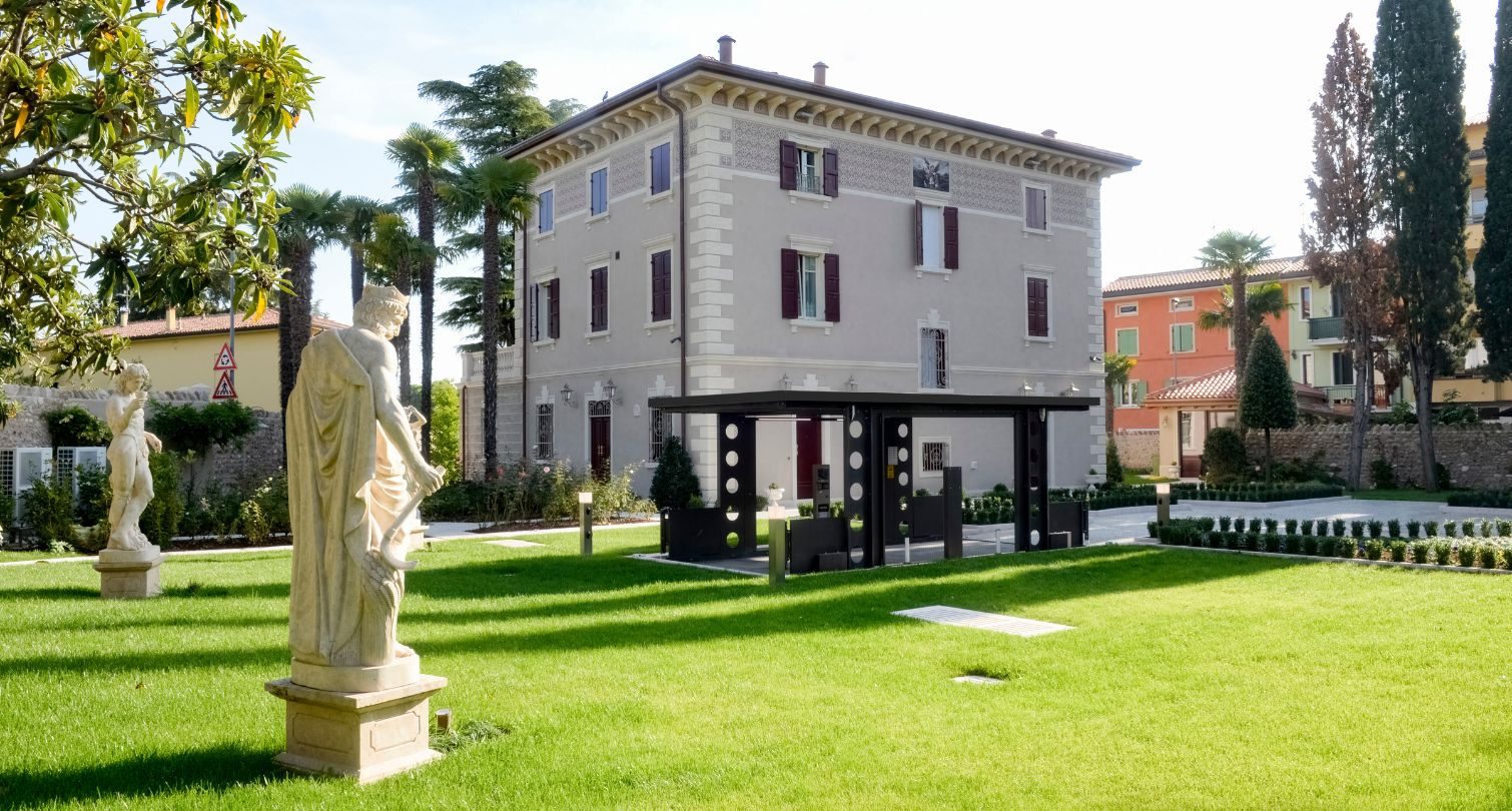 Car lift rising from the ground in the garden