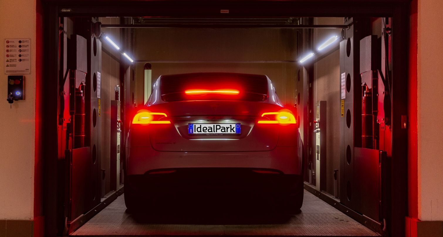 car in the carlift - driver on board